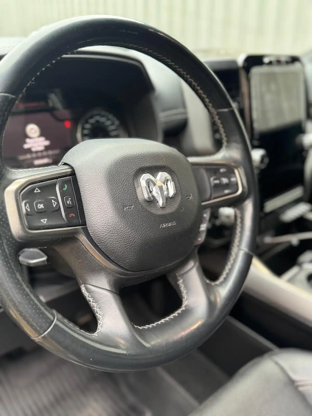 RAM 1500 steering wheel and dashboard from the driver seat, an example of interior work